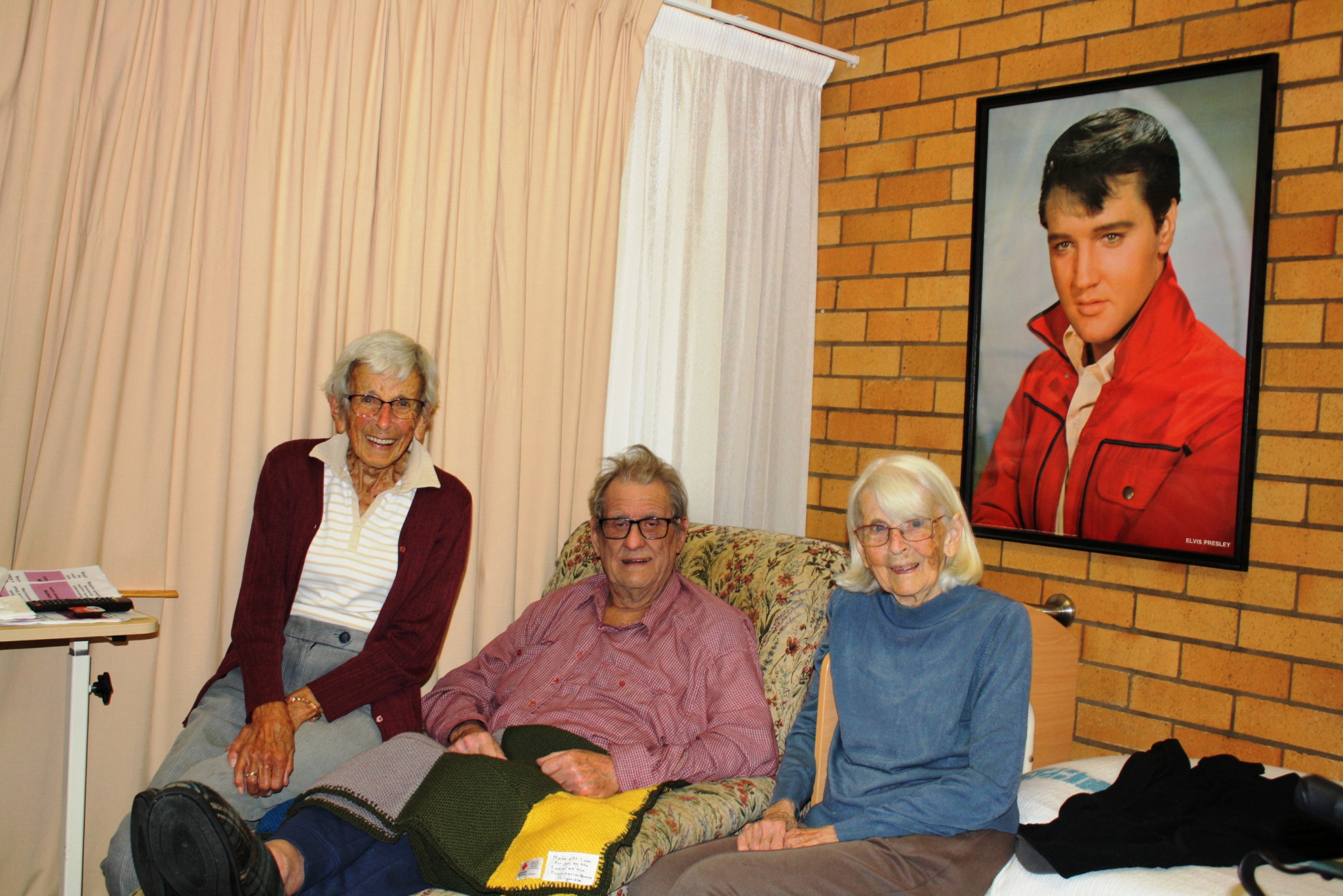 Harold happy to accept rug from Pat Lummis and Beryl McKenzie Photos supplied.