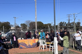 Gilgandra Local Aboriginal Land Council chairperson, Eileeyo Louie, raises the Aboriginal Flag on Monday, July 14 to begin local NAIDOC Week celebrations.
