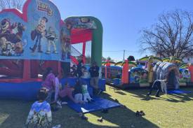 The jumping castles were popular with the children.
