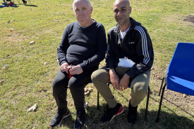Daniel Hood and Matthew Moore having lunch in the sun.