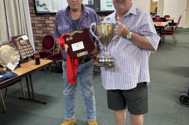 Peter Lummis presenting the Petrie’s Mitre 10 Trade Centre Drumtochy Cup trophy to winner John McWhirter.