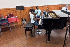 Young pianist Janos Rajan delighted the crowd with his performance of a few Christmas songs, all played from memory.