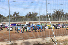 All the drivers in the Gilgandra Speedway’s season opener gathered on the track during the officially reopening ceremony.
