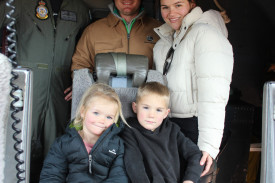 Flying officer James Triantafilis showing the Parry family’s Don, Matilda, Chase, and Mel around in the Hercules’ cockpit.