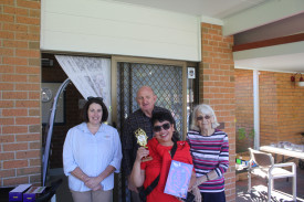 Best baker judges: Donna Dobson, Paul Mann, and Beryl McKenzie with Best Baker winner Marissa Raines (front).