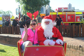 Merscia Kouroulis with Santa Clause.