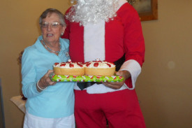 nan-nalder-presents-santa-with-special-sponge-cakes-made-by-nancy-semmler—-a-special-favourite-of-santa.jpg