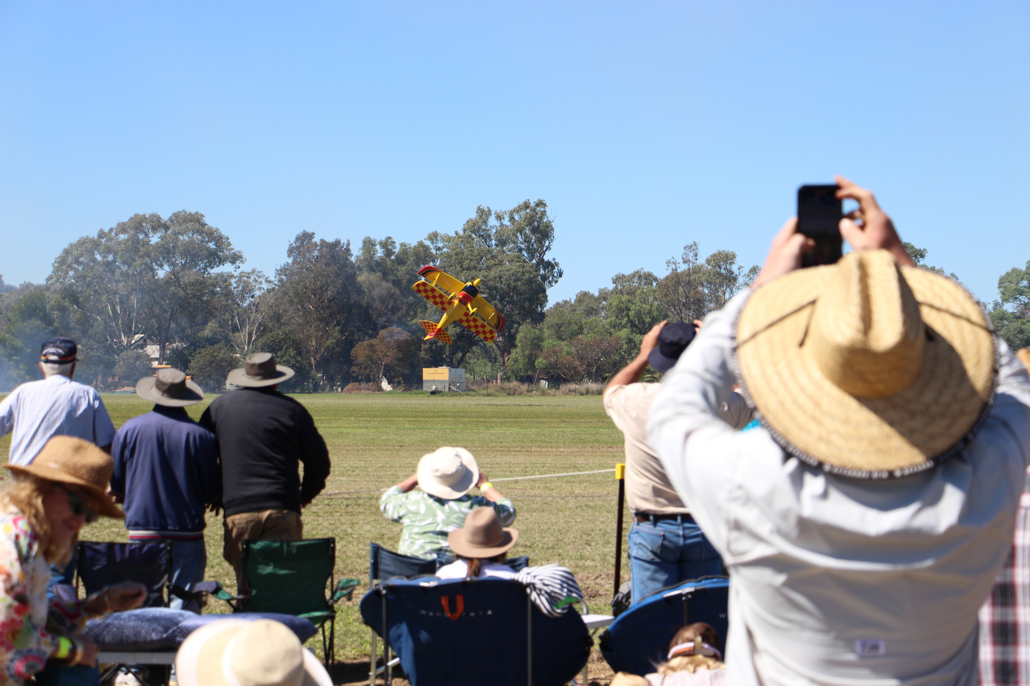 Pilot Paul Bennet enacting his signature ‘photo shot’ above the runway as part the 2025 Tooraweenah Airshow on Saturday, April 5. Photo by The Gilgandra Weekly: Lucie Peart.