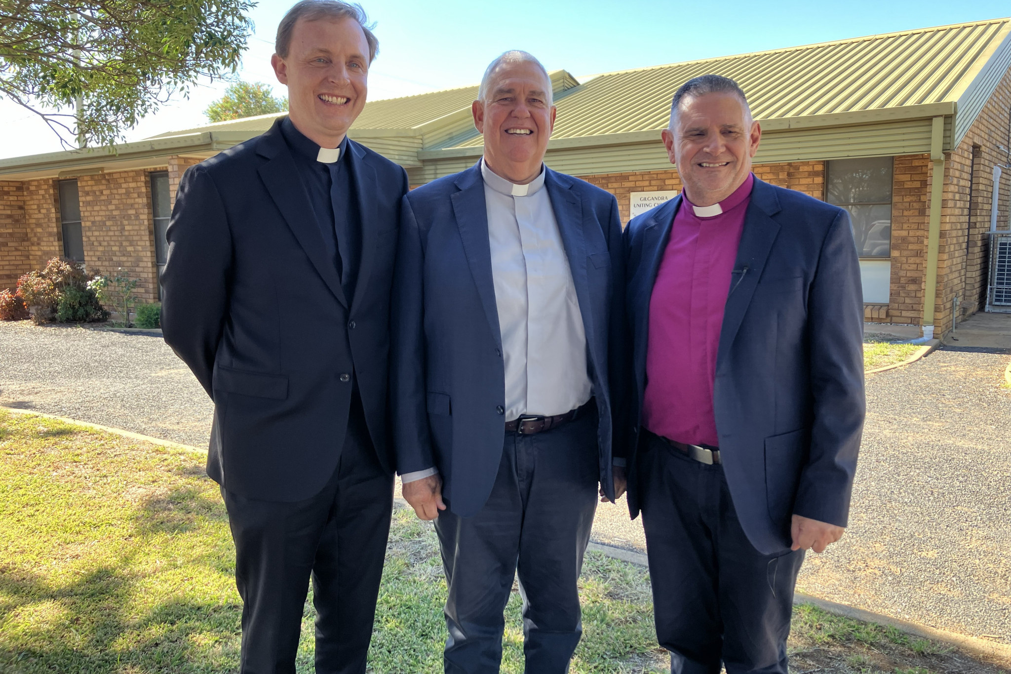 Reverend James Daymond, with Deacon-in-Charge of Gilgandra Anglican Parish, Stuart Border, and Bishop Mark Calder on May 23, 2026 at Stuart&rsquo;s commissioning. Photo supplied.