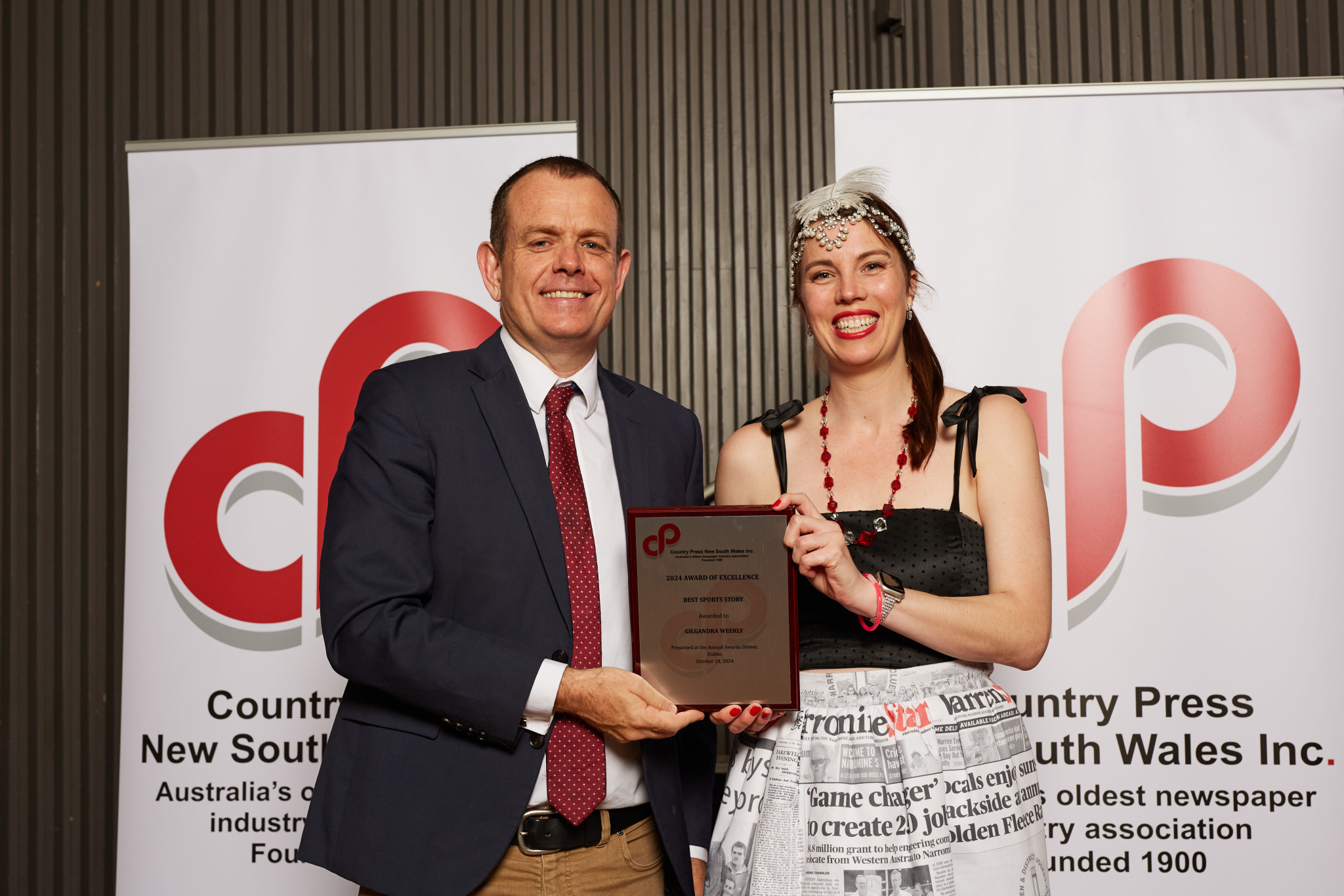 Dubbo MLC Stephen Lawrence, presenting the 2024 Country Press NSW Inc Award for Best Sports Story to publisher Lucie Peart. By Country Press NSW Inc.