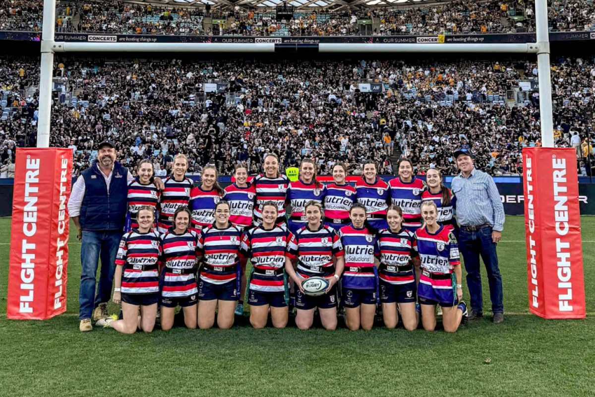 Members of the Gulargambone Rugby Union Club made a special trip to Sydney to support the Flamin' Galahs when they played a Tri Tag exhibtion match during half-time at the recent Bledisloe Cup at Accor Stadium. Pictured are coaches Greg King and Zac Mills with the women’s team. Photo supplied.