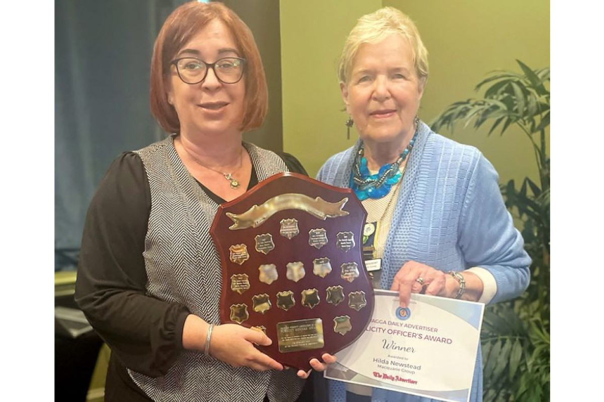 Editor of the CWA of NSW Country Woman Journal Sonia Roberts presents Hilda Newstead with the Publicity Officer Award. Photo supplied.
