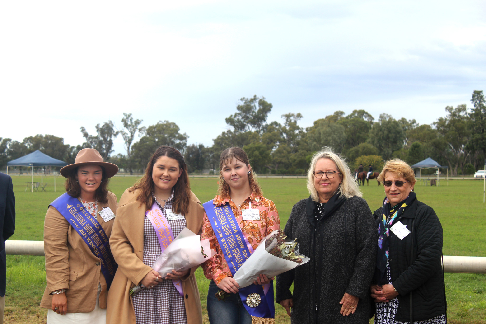 2023 Young Woman Award winner Emma Hutchison stands with 2024 Young Woman entrant Aliza Purvis, and 2024 Young Woman Tahlee-Rose Duffy, alongside Dubbo judges Pip Archer and Sue Hood. Photo by The Gilgandra Weekly: Nicholas Croker.