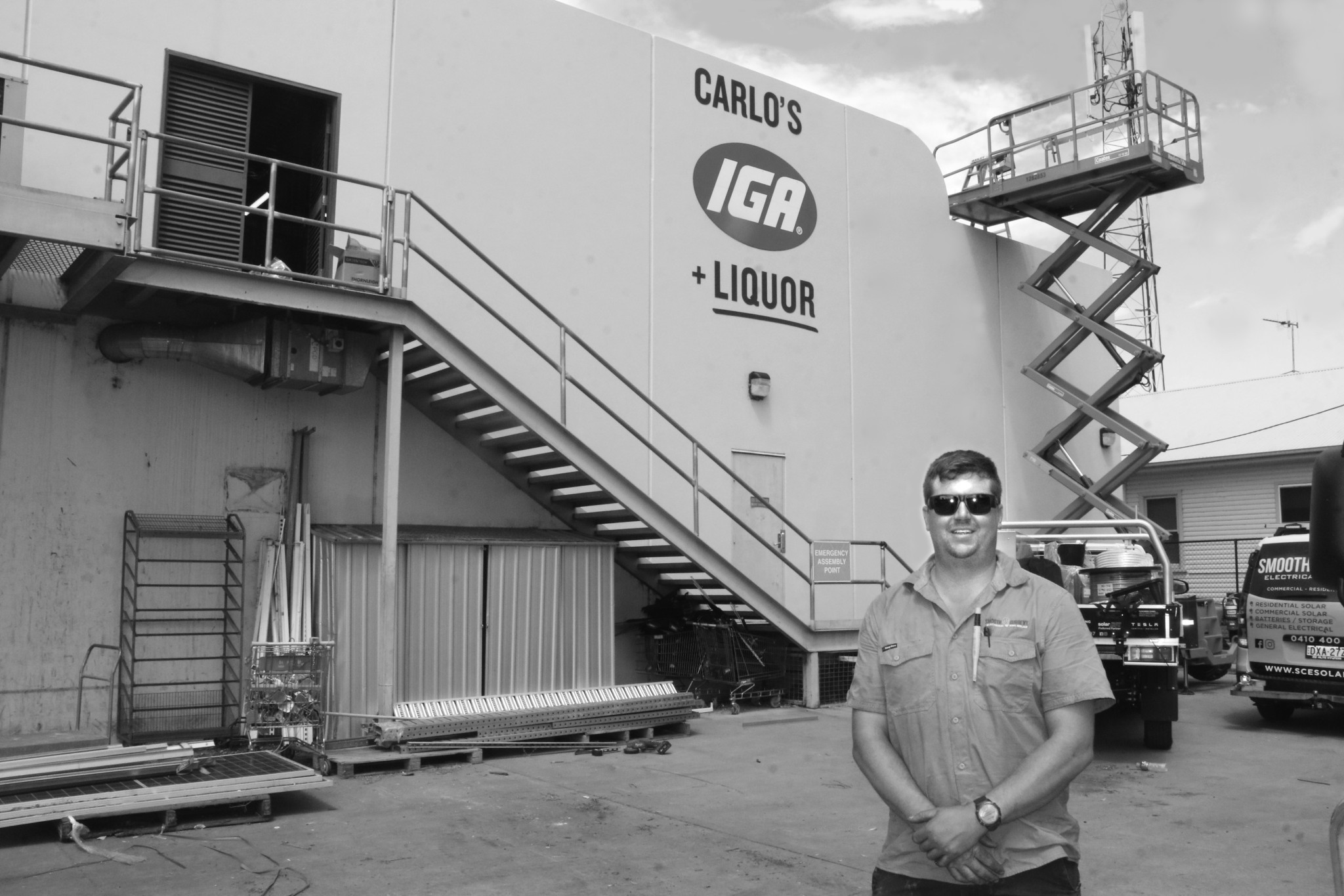 Jessie Edwards with some of the panels set to be assembled on the roof of Carlo’s Supa IGA. Photos by The Gilgandra Weekly.