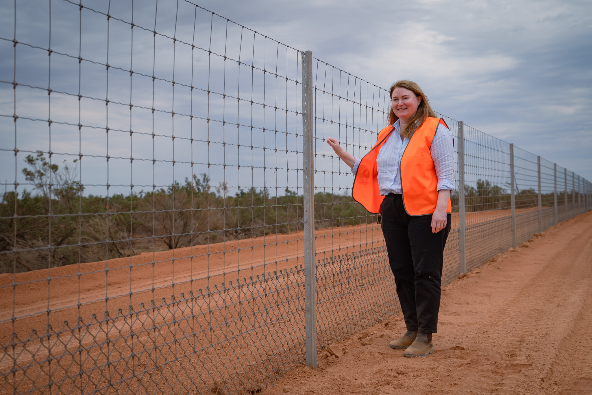 NSW Minister for Agriculture and Regional NSW, Tara Moriarty inspecting the completed Wild Dog Fence. Photo supplied.