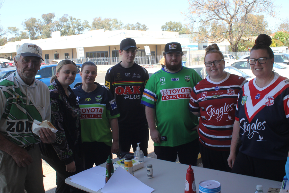 Rambo Young, Tayarna McKenzie, Lesley Riley, Alex Sandry, Cody Dann, Kiara McKenzie, and Kirstie Bugmy at IGA’s barbecue fundraiser last week. Photo by The Gilgandra Weekly: Nicholas Croker.