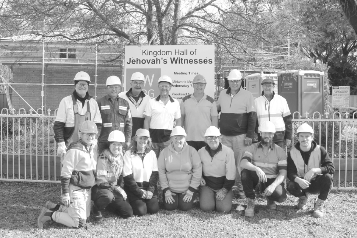 Volunteers of the renovation project outside the Kingdom Hall. Photo by The Gilgandra Weekly.