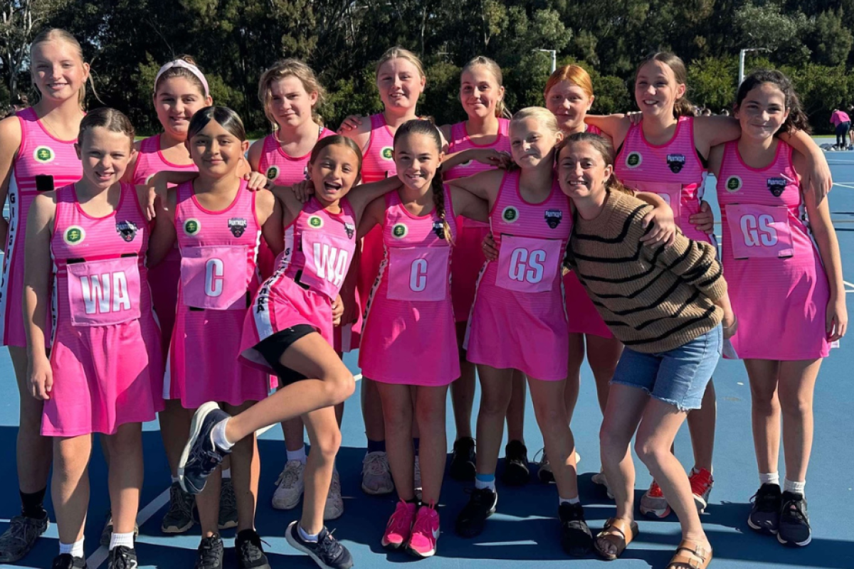 Under 12 Panthers netball side with coaches Lanie Barnes and Chloe Eason.