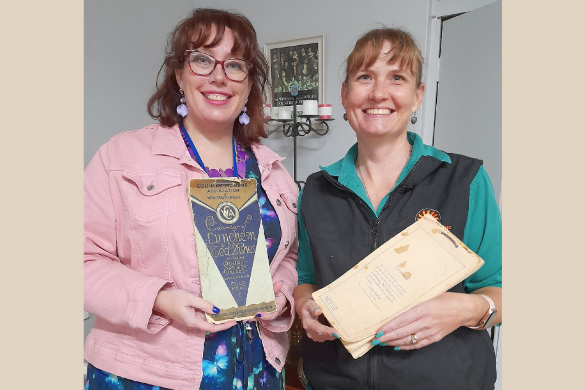CWA Evening Branch president Jess Reed with member Rebekah Makila and the CWA cookbooks. Photo contributed.