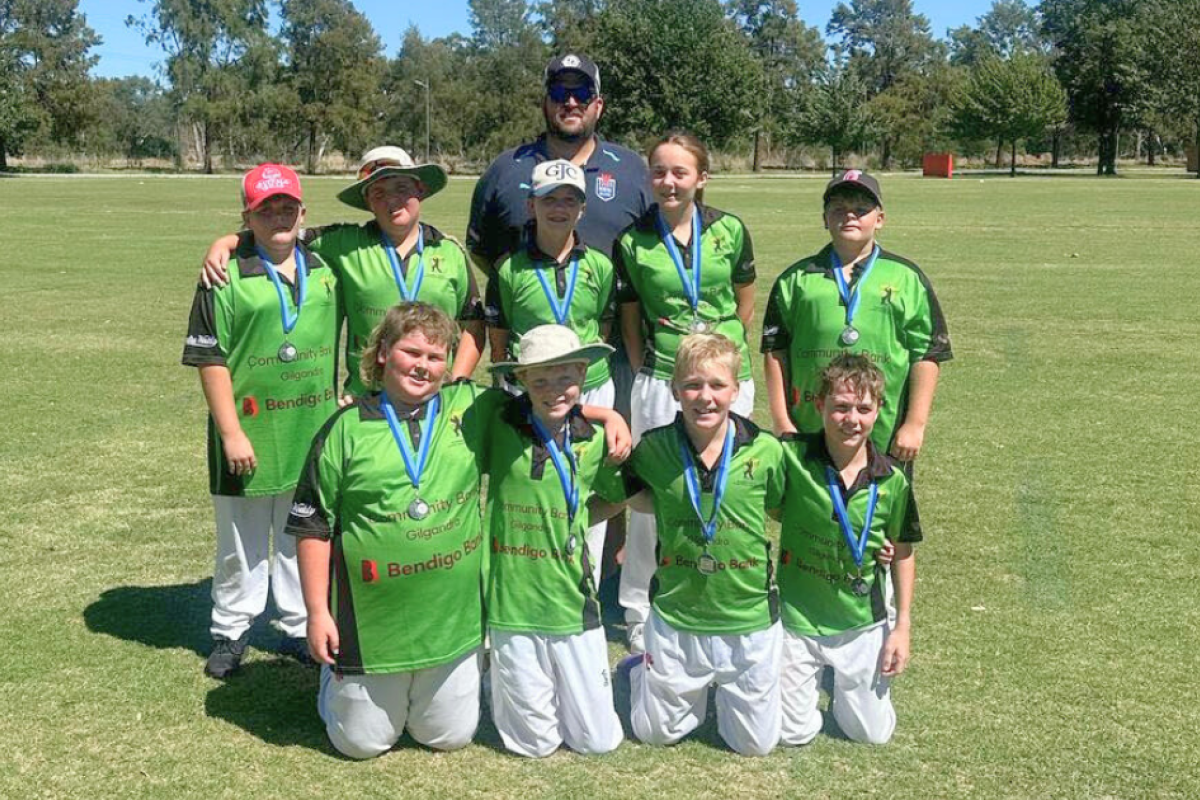The Gilgandra Thunder 12A side which made the 2024/2024 Dubbo District Junior Cricket Association grand final included, front, from left; Lachlan Fisher, Harrison Newton, Oliver Peart, Mitchell Beaton, and back, from left; Jackson Towns, Oscar Medd, Lucy Zell, Claudia Harrison, and Braxton Towns with coach Randall Medd. Photo supplied.