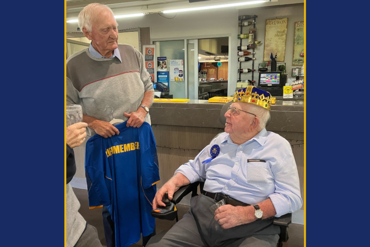 Bob Dicks presenting Blue Milgate with a Gil Sporties Life Member bowls shirt. Photo supplied.