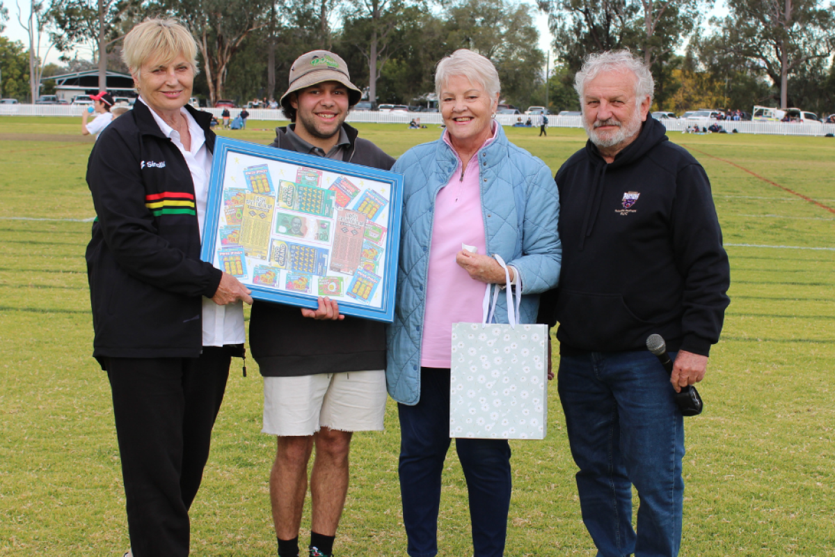 Gilgandra and District Cancer Fundraisers representative Sue Gregory with winner of the scratchie raffle Cameron Bamblett, cancer fundraisers president Wendy Nelson and Castlereagh League secretary Bryson Luff. Photo by The Gilgandra Weekly: Lucie Peart.