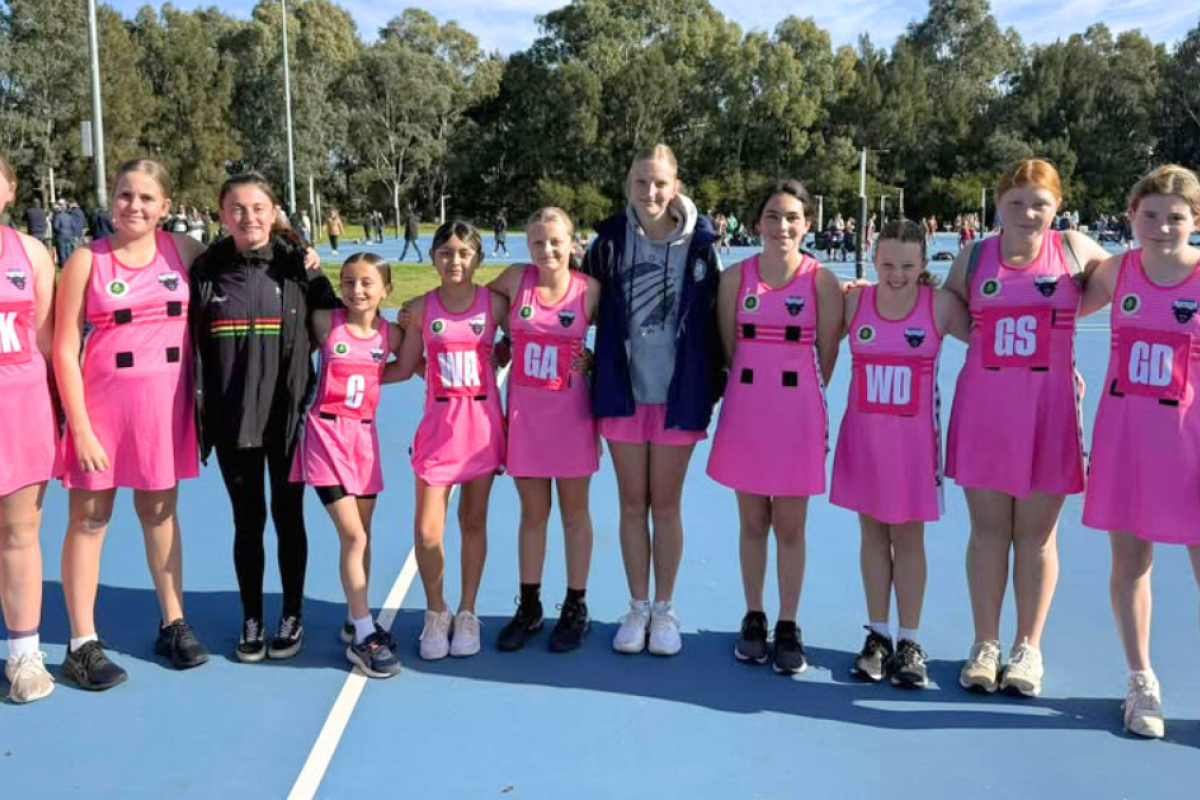 U12 netballers with coaches Lanie Barnes and Chloe Eason.