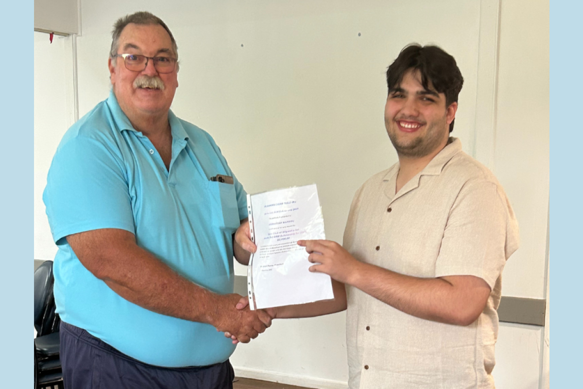 Gilgandra Lions president Brenton Penna presents the 2025 Neville Toll OAM Scholarship to Sebastian Manusu. Photos supplied.