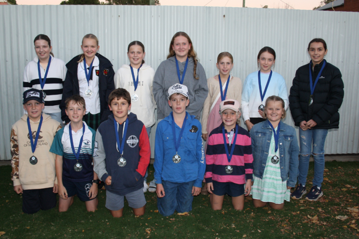 Medals for 100 per cent participation. Back row: Milla Morris, Pippa Rogers, Lottie Duffy, Brooke Beaton, Alice Peart, Hattie Thomas, and Ruby Ryan. Front: Oliver Peart, Mitchell Beaton, Bill Ryan, Darcy Adams, Hannah Peart, and Hannah Meers. Absent Shane Debritt.